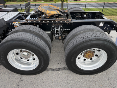 Kenworth T680 dual rear wheels and chassis frame with fuel tank area visible.