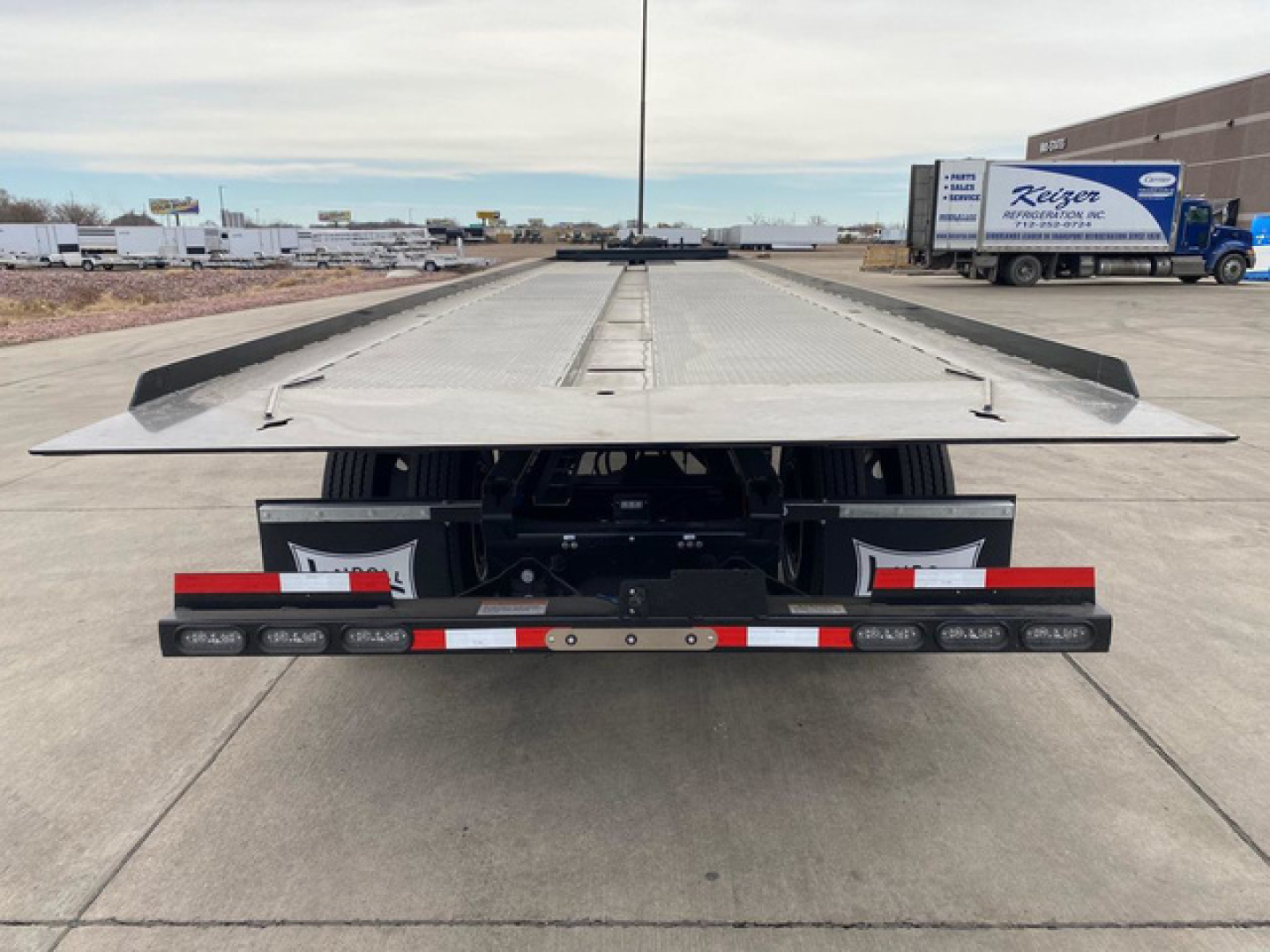 Landoll container trailer rear view showing flatbed platform and taillights
