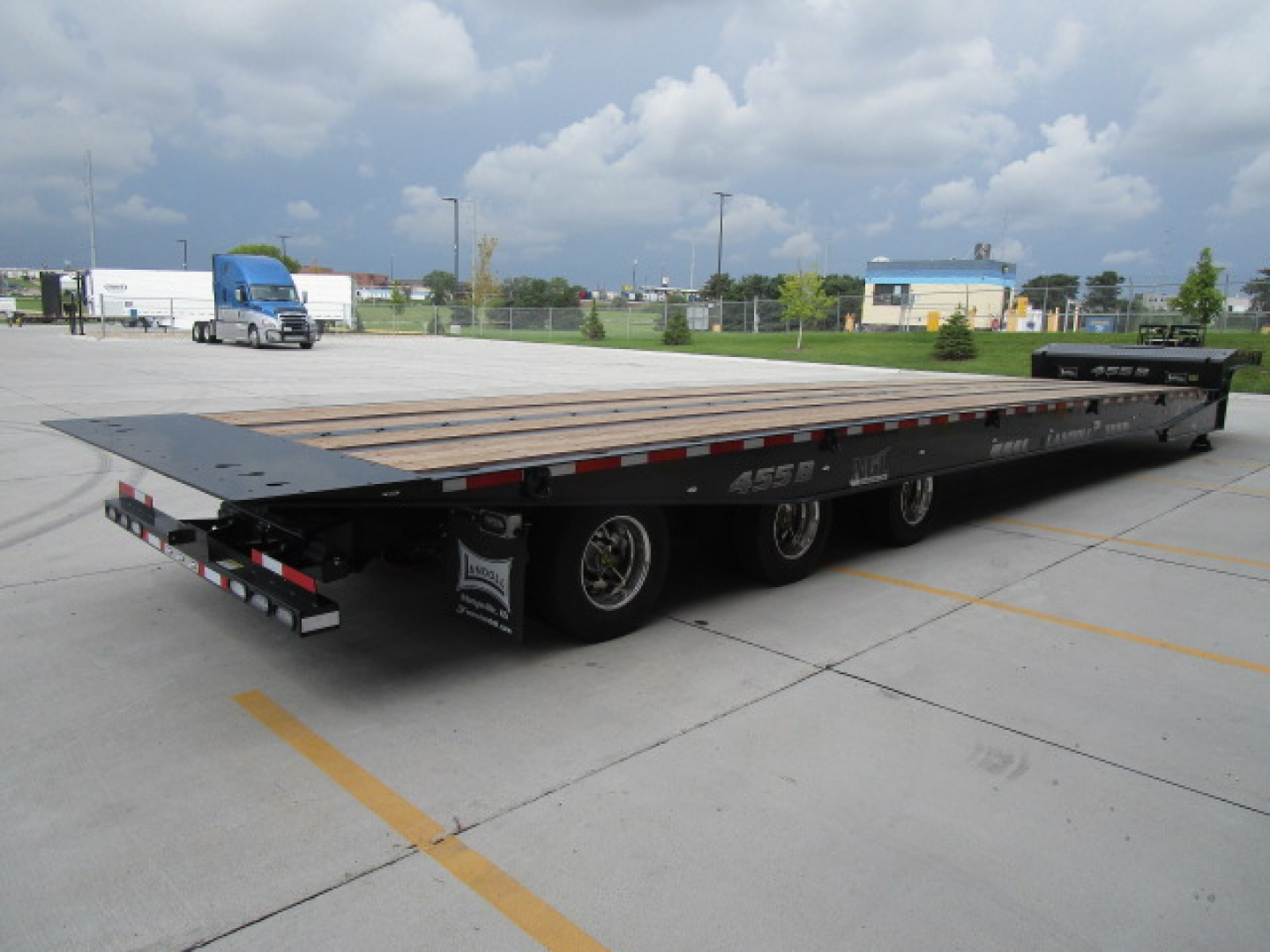 Landoll 455 trailer with wooden deck and low-profile gooseneck, dual rear axles, stock number N86226 visible, Travel axle category, new condition.