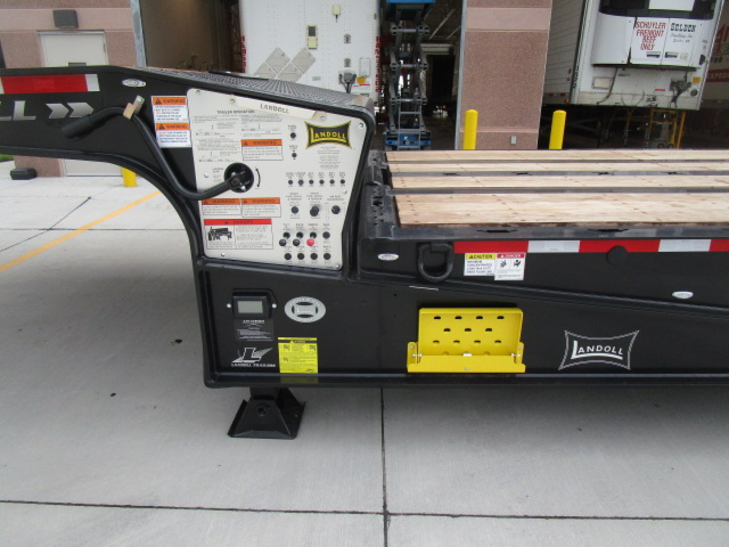 Landoll 455 traveling axle trailer deck with control panel and yellow entry step, side labels, and stock number N86226.