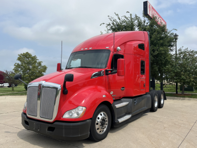 Kenworth T680 heavy-duty truck in red, front three-quarter view showing grille, headlights, and side mirrors.
