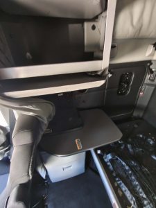 Kenworth T680 interior showing workspace desk area and control panel