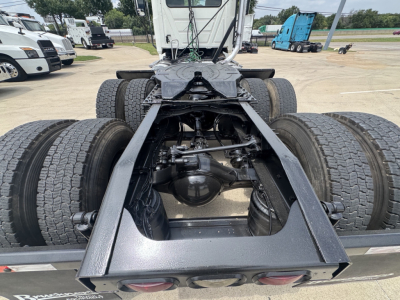 Chassis of a 2020 Mack PI64T truck showing rear duals and drivetrain components, including differential, suspension, and frame rails.