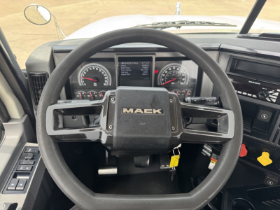 Mack PI64T truck dash showing steering wheel with Mack logo and instrument gauges