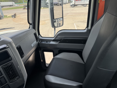 Cab interior of a 2020 Mack PI64T truck showing front bench seat and dashboard details