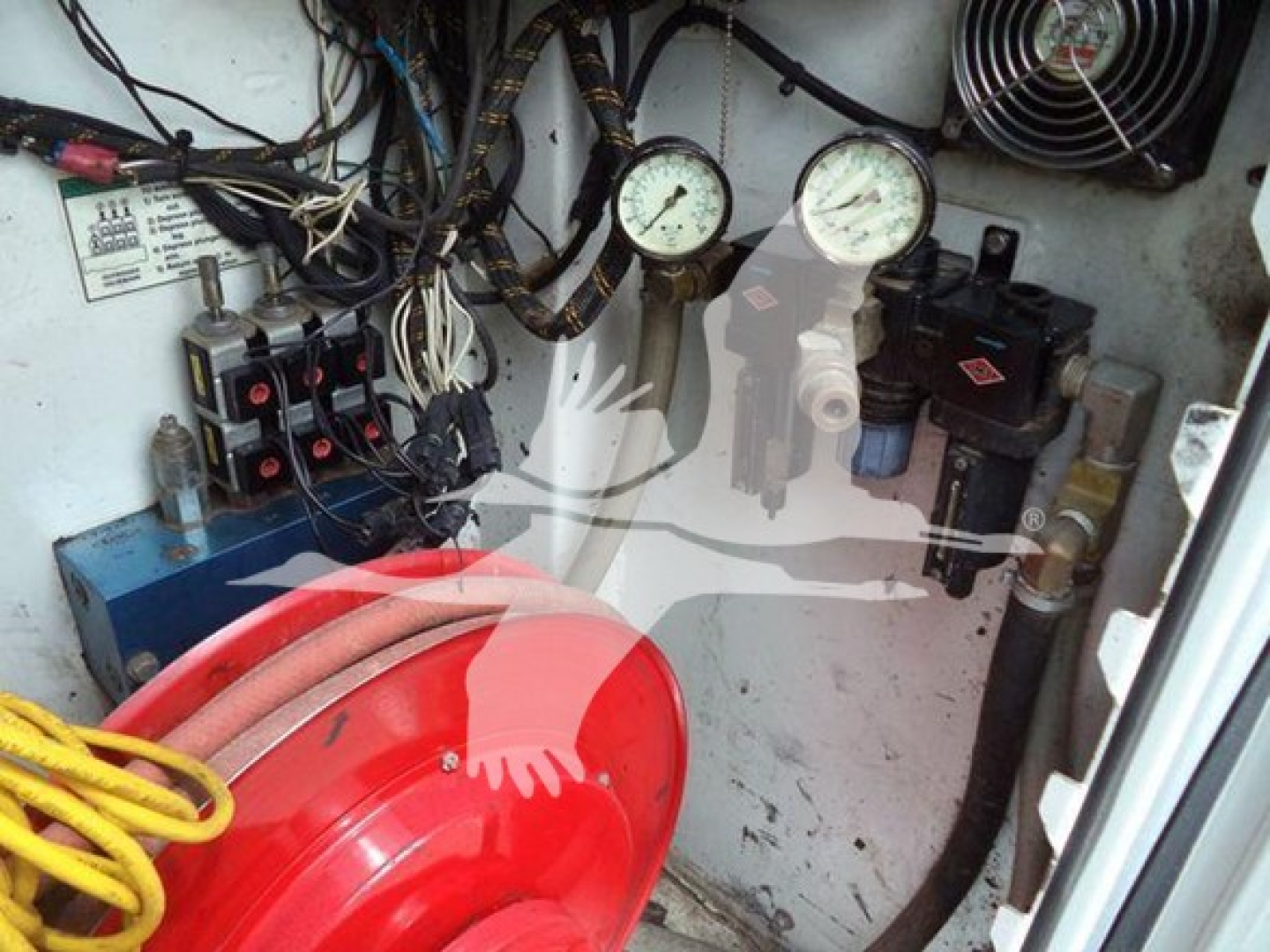 Dashboard and control panel in Kenworth T270 service truck cockpit showing gauges, wiring, and hydraulic components.