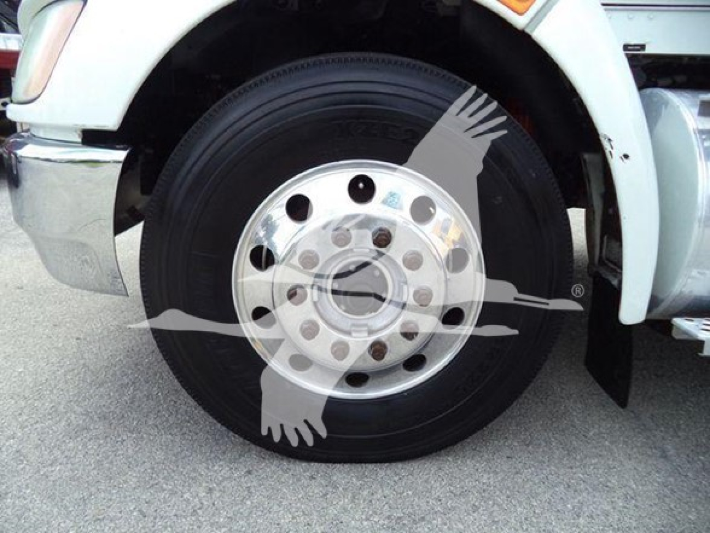 Kenworth T270 front wheel showing aluminum hub with multiple lug nuts and black tire