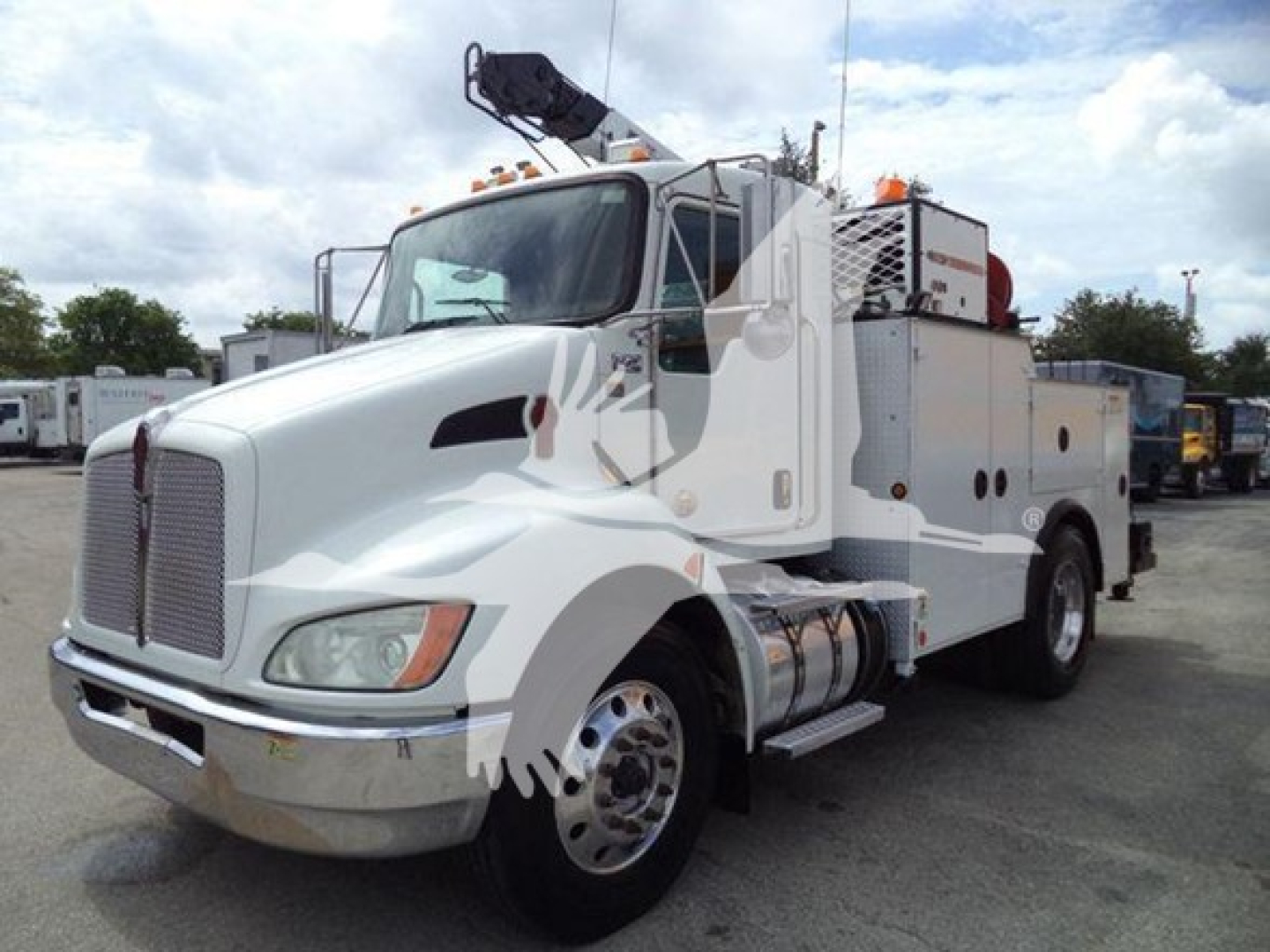 Kenworth T270 service truck in-use condition showing front grille, cab, utility body with equipment compartments, crane arm on top, and fuel tanks.