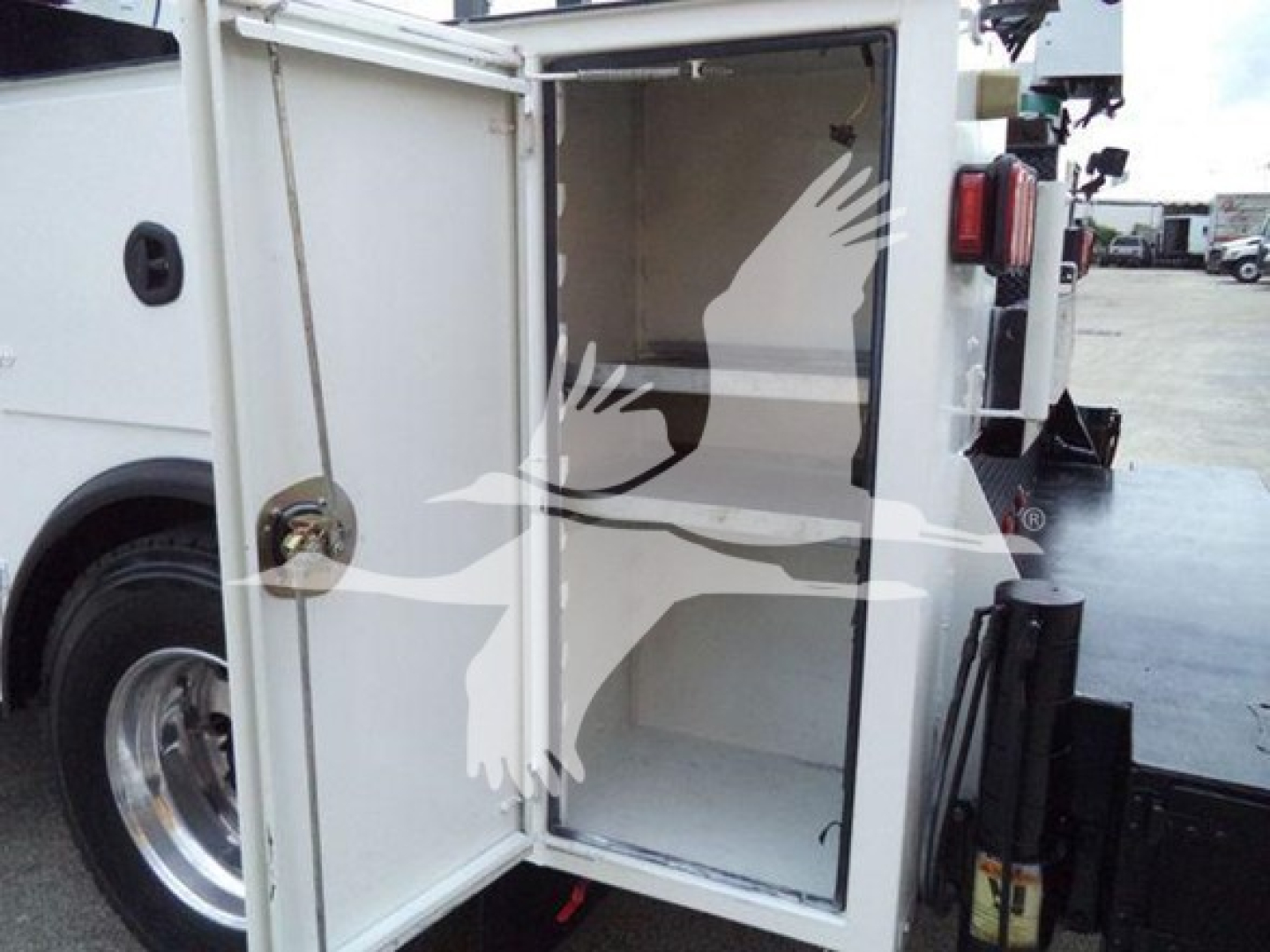 Kenworth T270 service truck rear cargo door open showing empty storage compartment inside utility body.