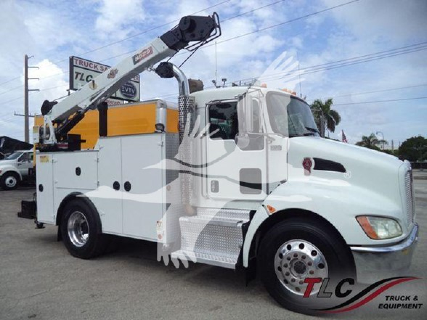 Kenworth T270 service truck with crane, side view showing DOT numbers and equipment labels.