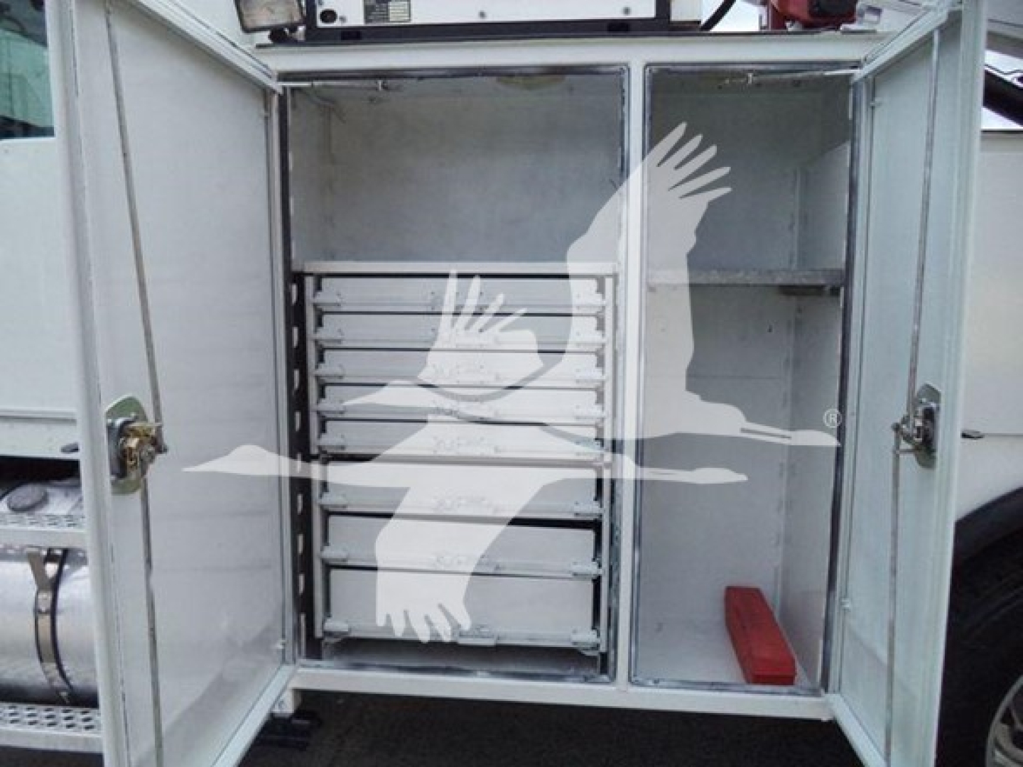 Kenworth T270 service truck rear cabinet with multiple drawers and metal shelving, open doors showing organized tool drawers and a red tool tray.