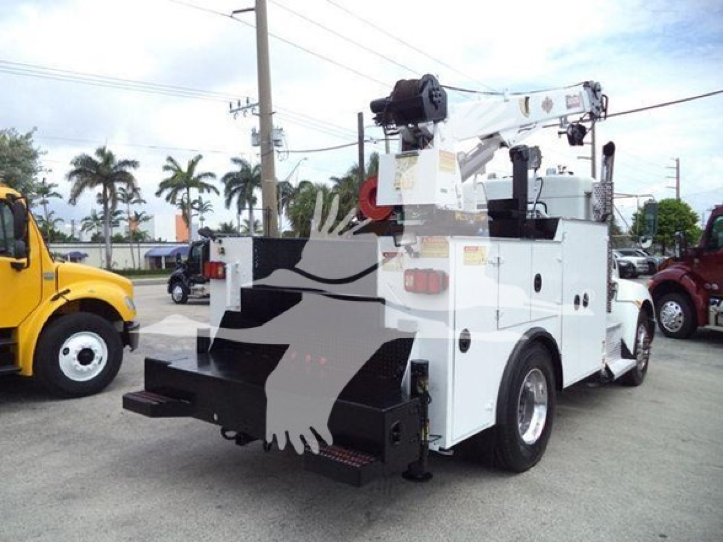 Kenworth T270 service truck rear view with crane, white body, stock towing equipment, visible tool compartments and rear bumper.