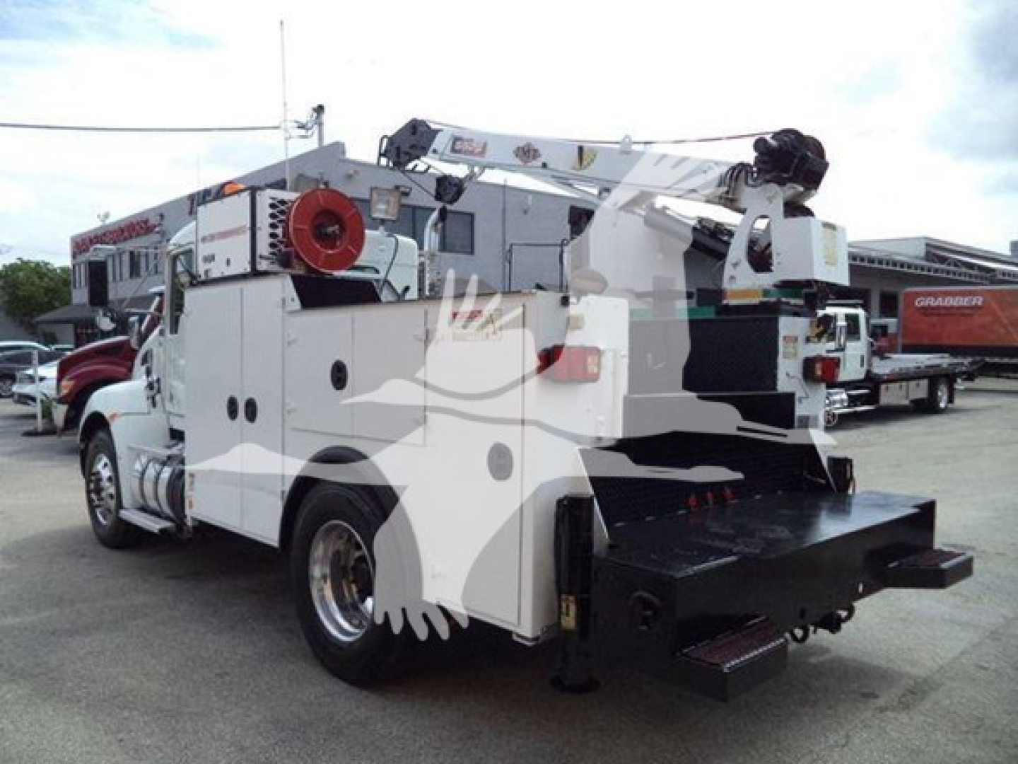 Kenworth T270 service/utility truck in view showing tool compartments and rear platforms.
