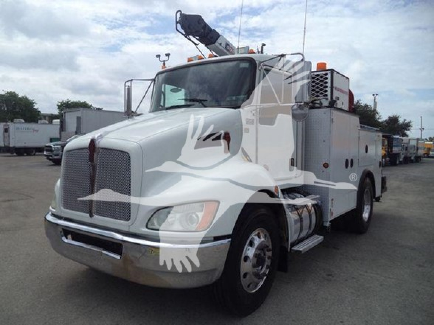 Kenworth T270 utility truck with crane on a lot, front-left view.
