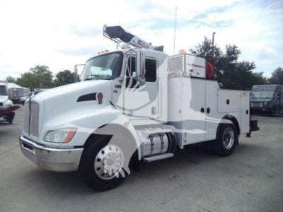 Kenworth T270 service truck in white with utility compartments and crane on top, front left angle, VIN 2NKHHM6X6EM413346 (stock T13346).