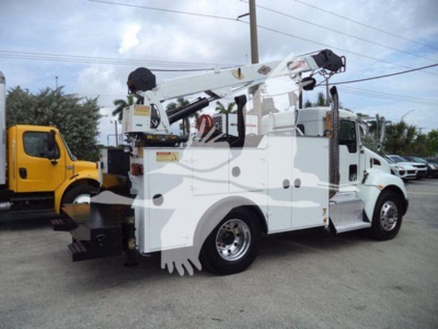 Kenworth T270 service truck with hydraulic boom crane, white cab and body, rear mounted equipment, side steps, and dual rear wheels.