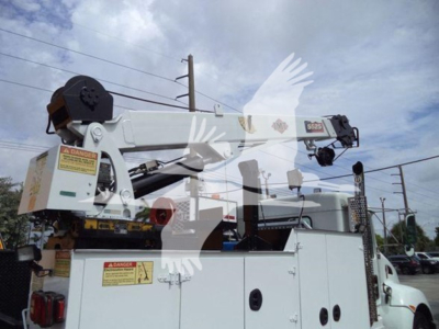 Kenworth T270 service truck with mounted boom crane and control boxes, view shows crane arm and safety labels.