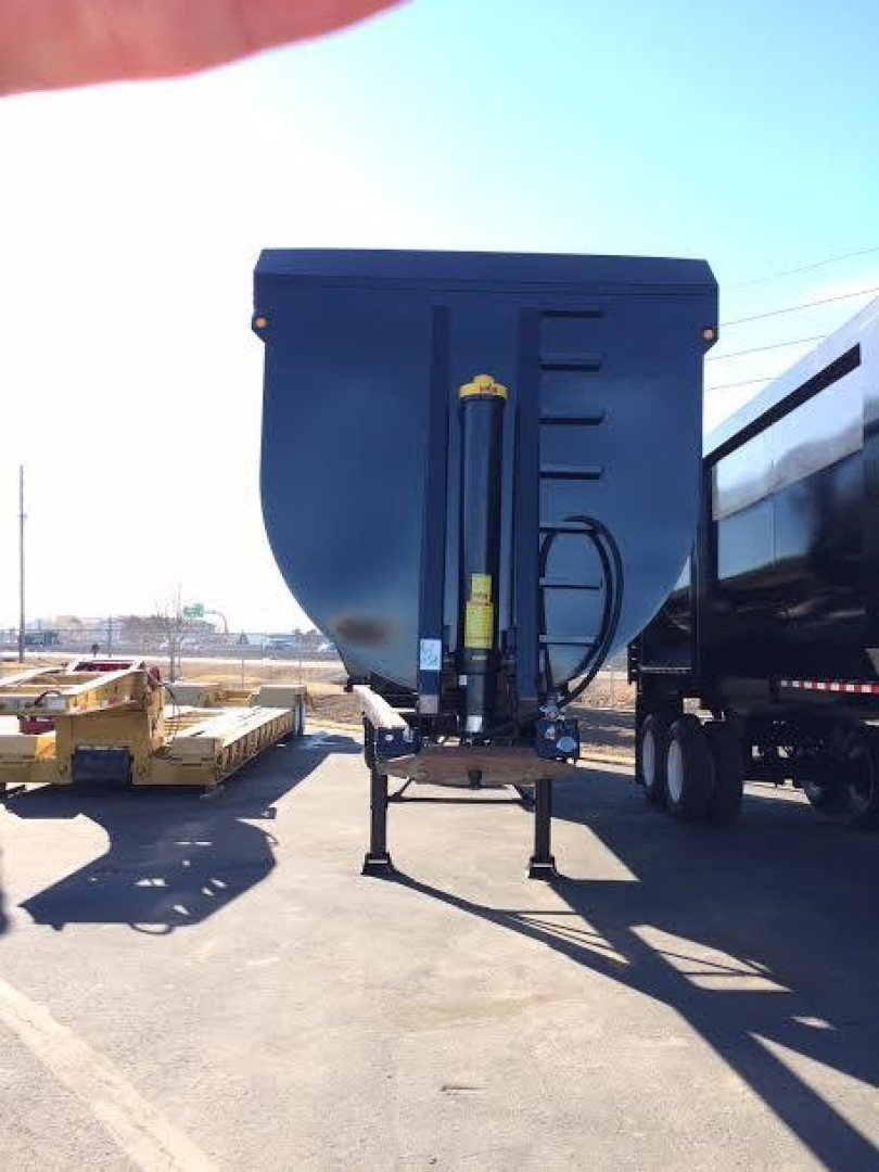 Dump trailer front view with hydraulic cylinder and hitch, blue paint, stock trailer for CPS scrap trailer.