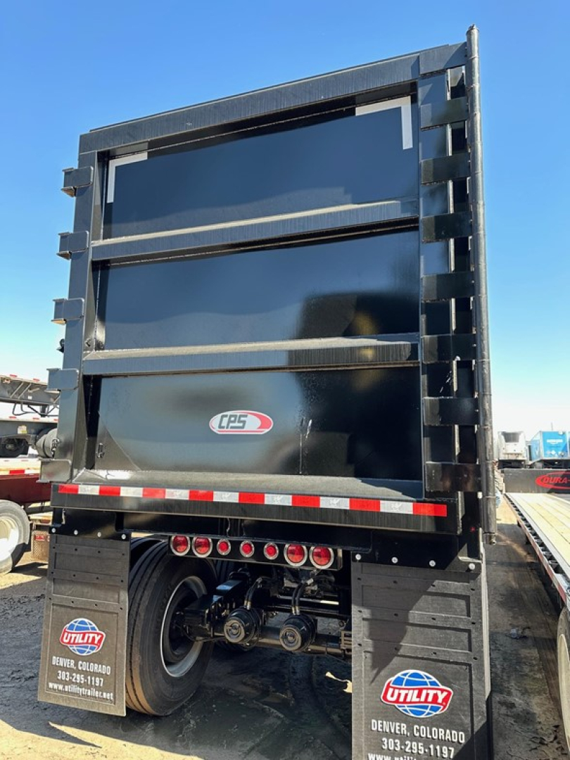 CPS scrap trailer dump bed showing CPS logo and rear with hydraulic components and mud flaps.
