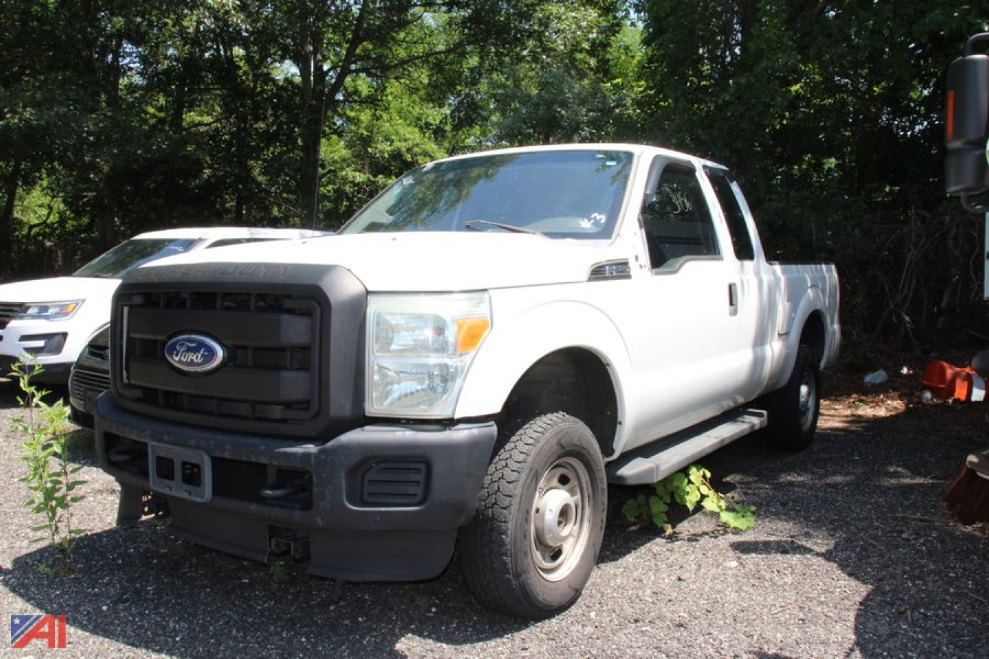 Ford F-250 Super Duty pickup truck extended cab front-left view showing grille and bumper.