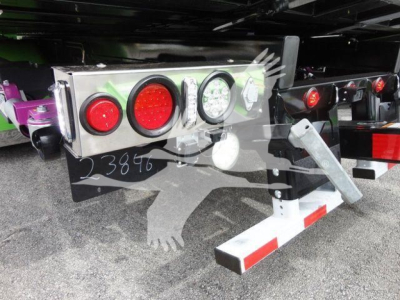 Peterbilt truck rollback rear showing taillights and bumper with reflective stripes and support legs