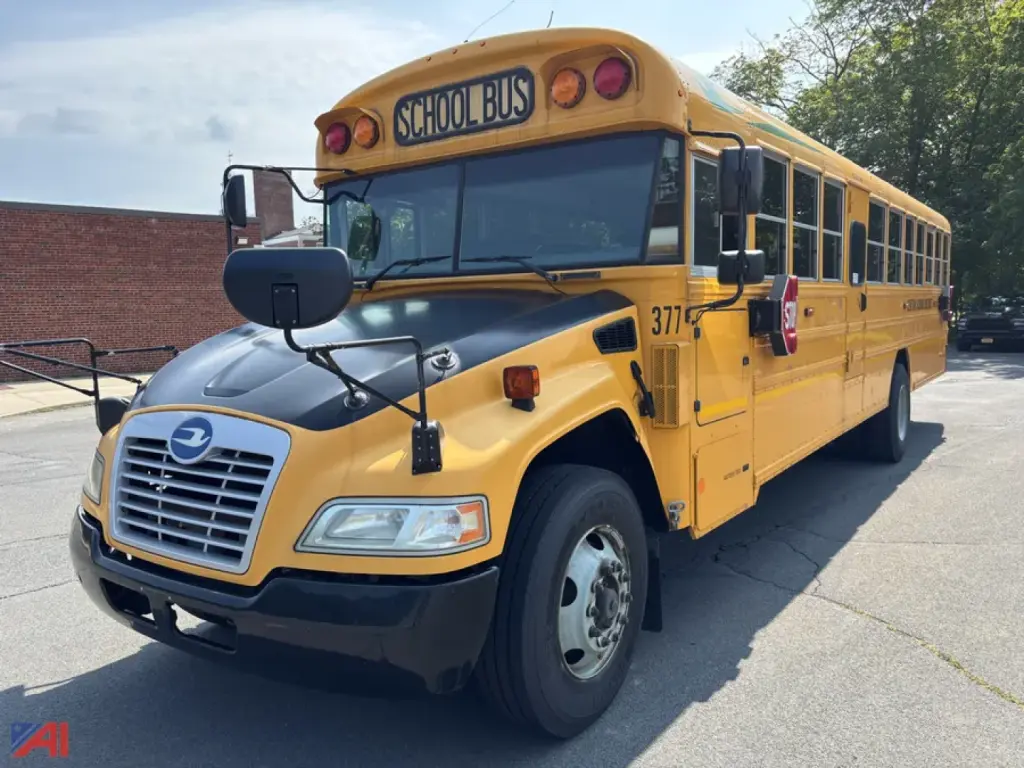 School bus 2018 Blue Bird BBCVB3011 showing front and side view with yellow body, black bumper, and 'SCHOOL BUS' sign on roof