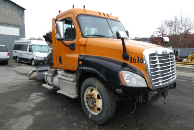 Freightliner Cascadia 125 daycab truck in orange and black with front grille and hood number 1616.