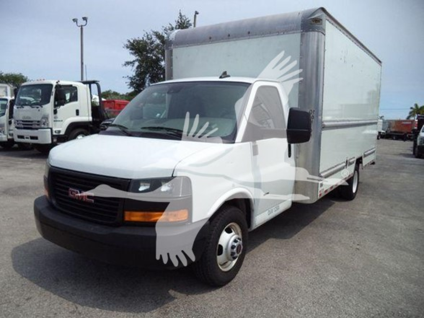 GMC 3500 cargo box truck in a side-front view showing cab and large box rear, white with black front bumper and orange turn signals.