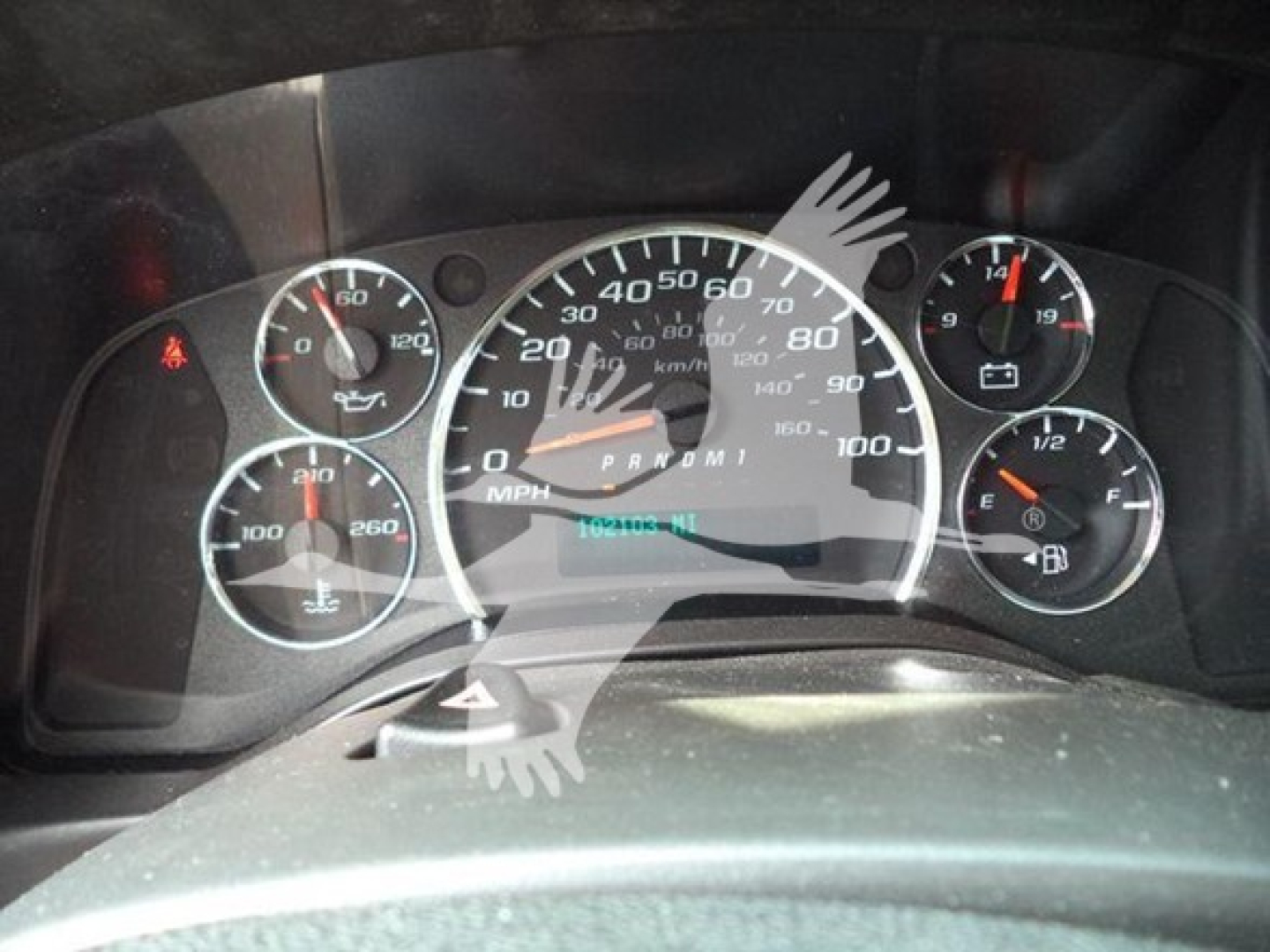 Dashboard gauges of a GMC G3500 cutaway showing speedometer, tachometer, fuel gauge, and coolant/engine indicators. Visible text includes MPH scale up to 100, and odometer area with numbers indiscernible; surrounding gauge labels not fully 