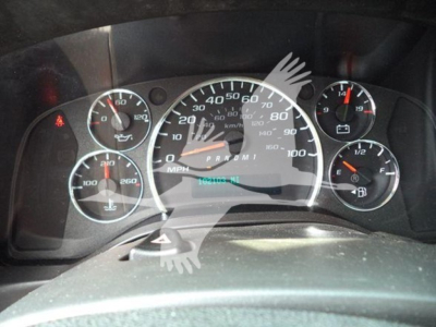 Dashboard gauges of a GMC G3500 cutaway showing speedometer, tachometer, fuel gauge, and coolant/engine indicators. Visible text includes MPH scale up to 100, and odometer area with numbers indiscernible; surrounding gauge labels not fully 