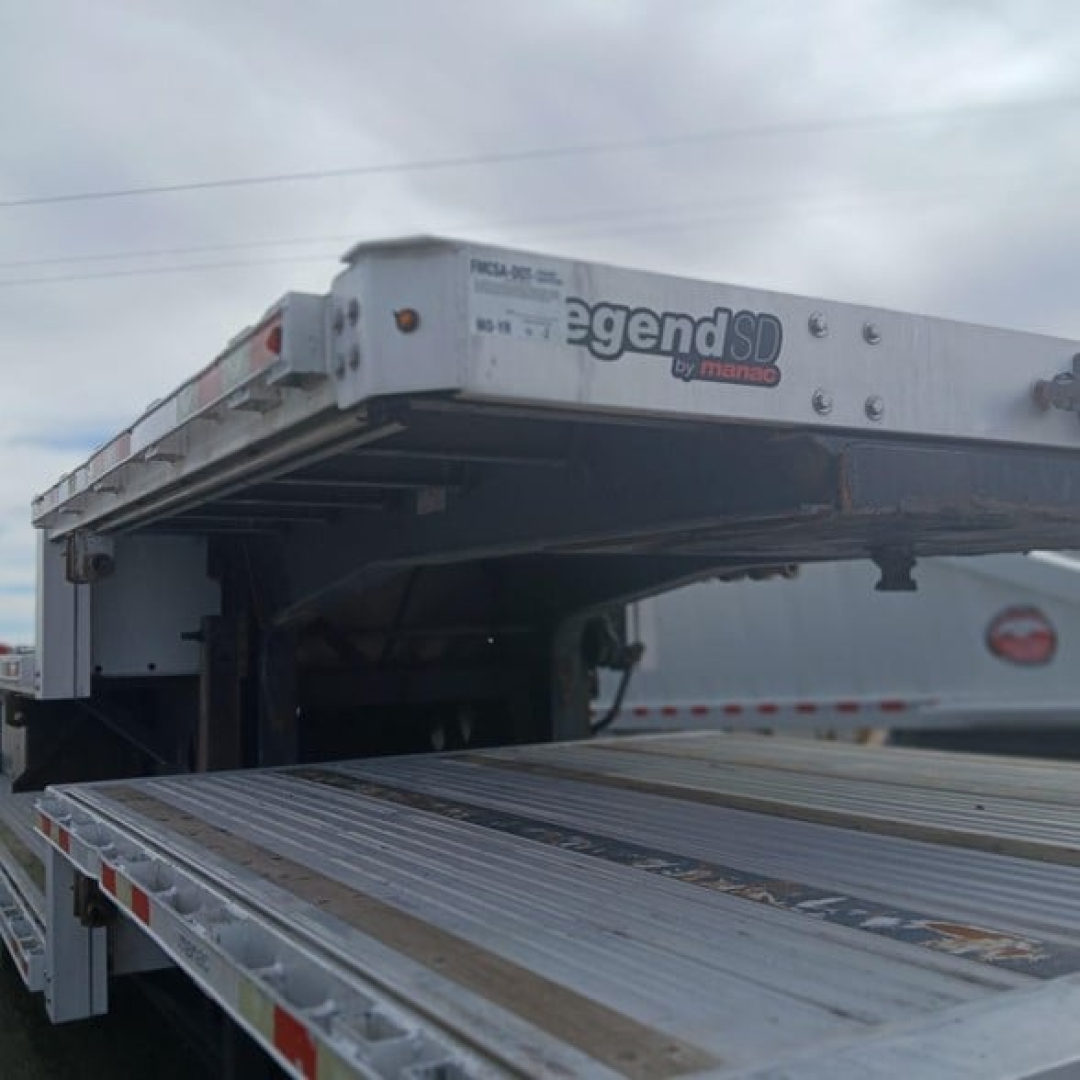 Manac Legend SD by Manac combo drop deck trailer shown in side view with extended deck and mid-frame components.