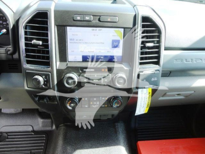 Ford F-550 cab interior showing center touchscreen display and dashboard controls.