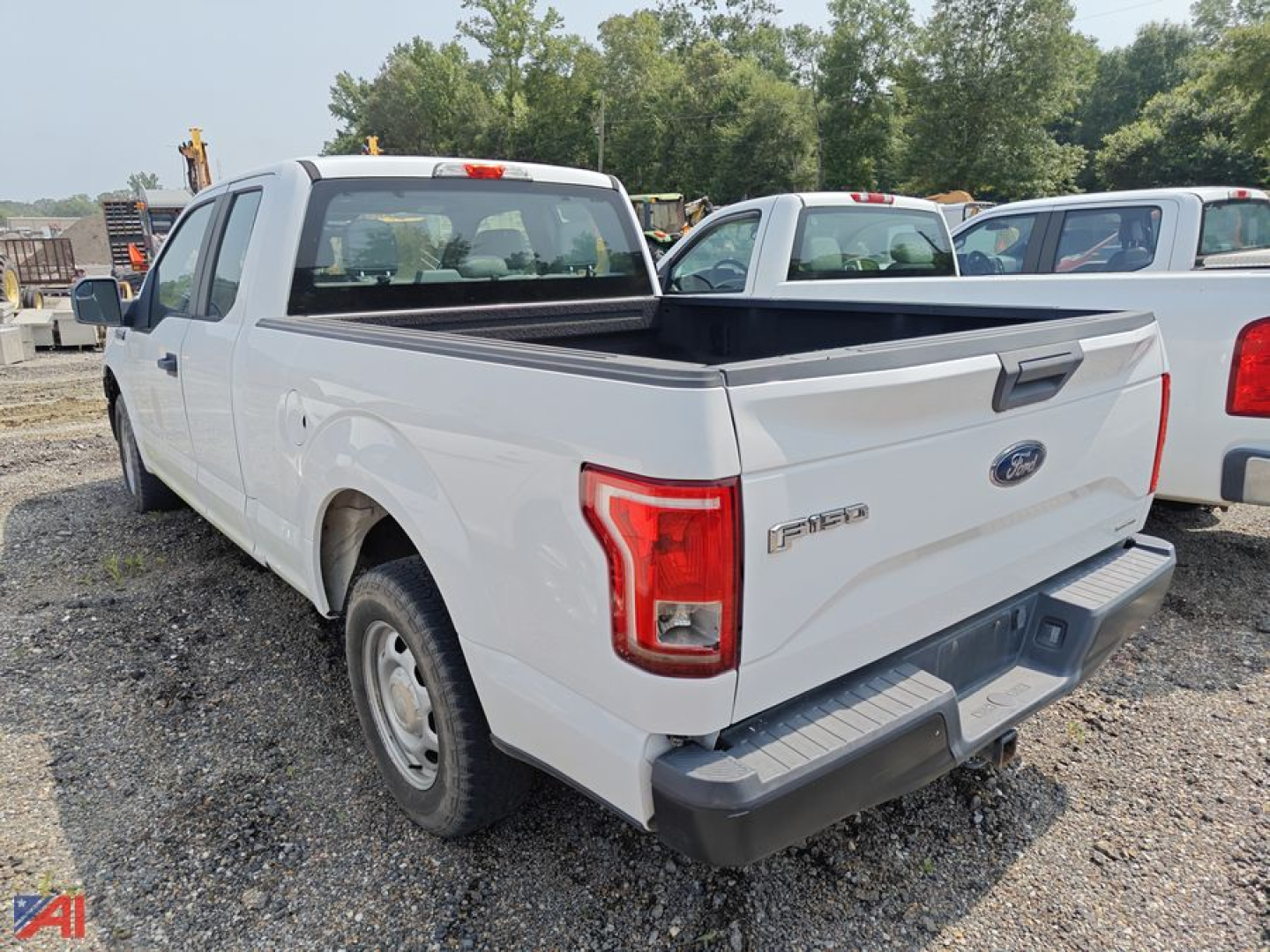 Ford F-150 pickup truck extended cab rear view showing tailgate and bed with white paint.