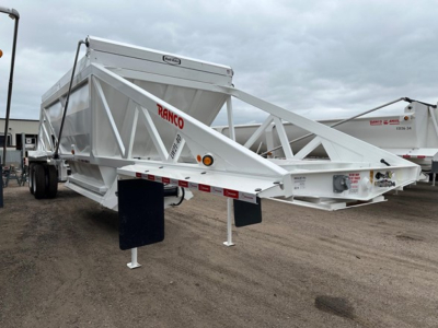 Ranco lw21-40 dump trailer in-service showing metal frame and landing legs with RANCO logo on side and white paint.