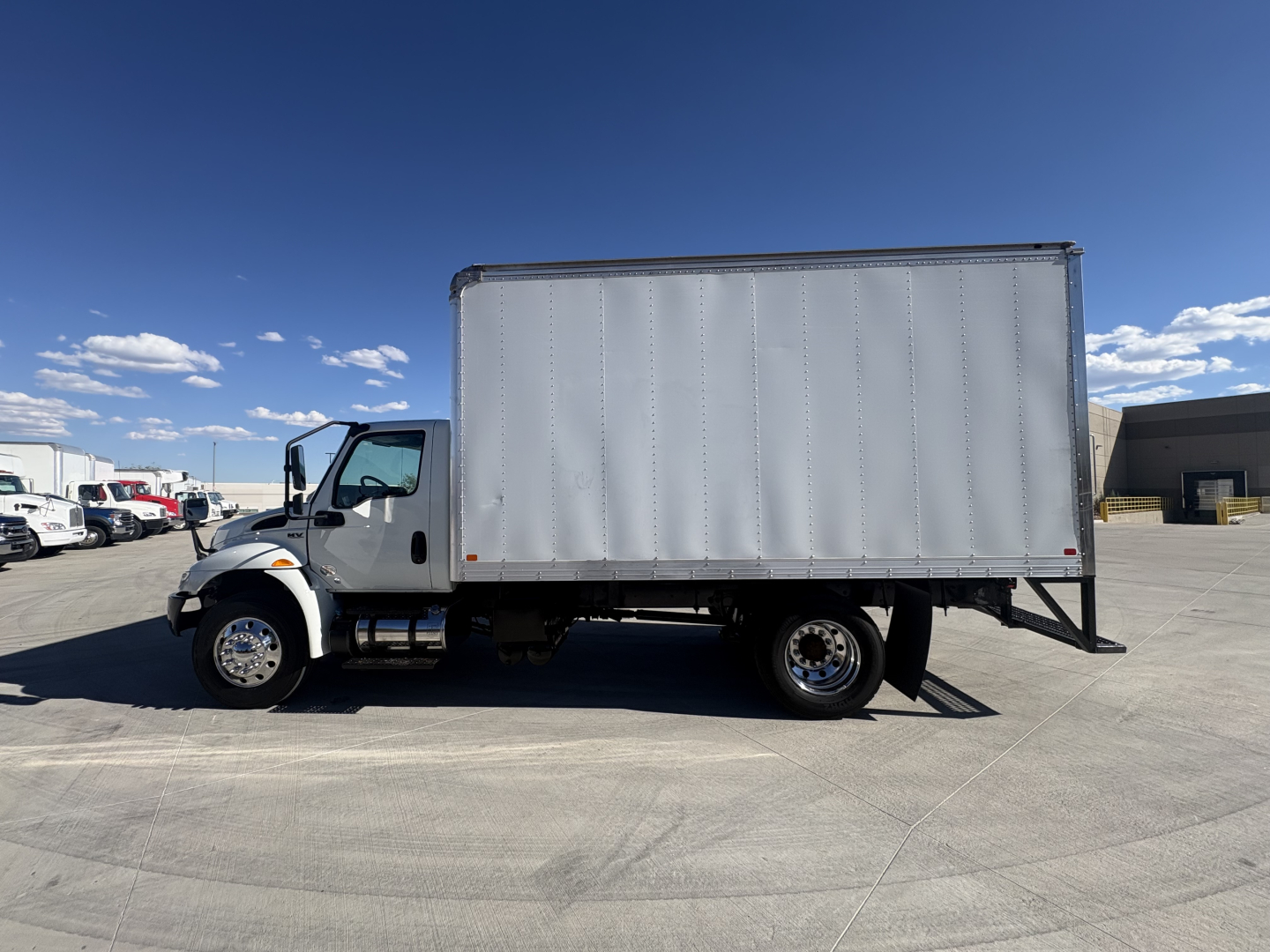 Truck box body on International MV607 with vinyl box siding and side profile view
