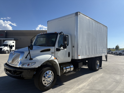 Truck box truck side view showing MV607 with white cargo box and cab, International badge, chrome bumper, dual rear wheels, daytime outdoor lot.