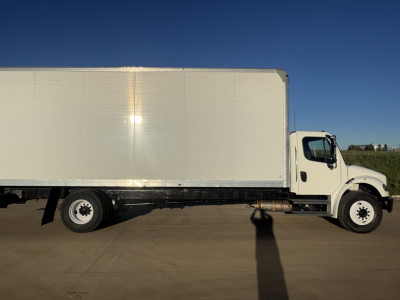 Box truck side view showing 2021 International MV607 with white cab and large rectangular cargo box.