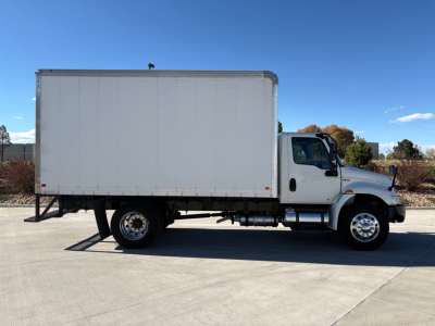 Box truck side view of a 2021 International MV607 with a large cargo box and cab in foreground, VIN 3HAEUMML4ML389414, stock 0632645.