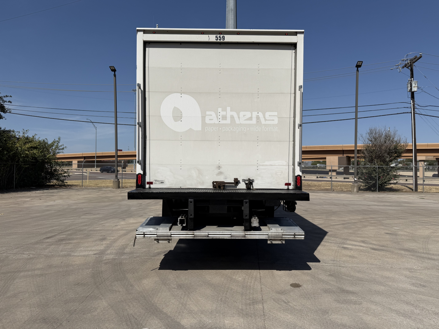 Kenworth T680 rear view showing box truck with Athens logo on rear door and stock number 0629619.