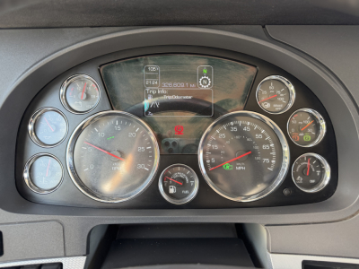 Kenworth T680 dash cluster showing multiple gauges and digital display with Trip info and MPG readouts.