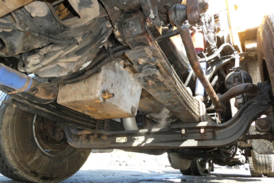 Peterbilt 357 chassis underside showing front axle, driveshaft, and engine oil pan with label text visible