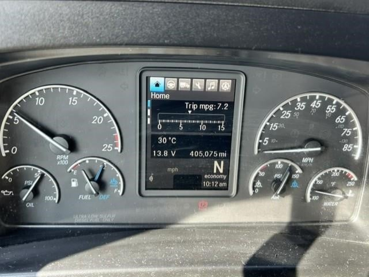 Dashboard of a 2021 Freightliner Cascadia 126 showing instrument cluster with digital screen and gauges.