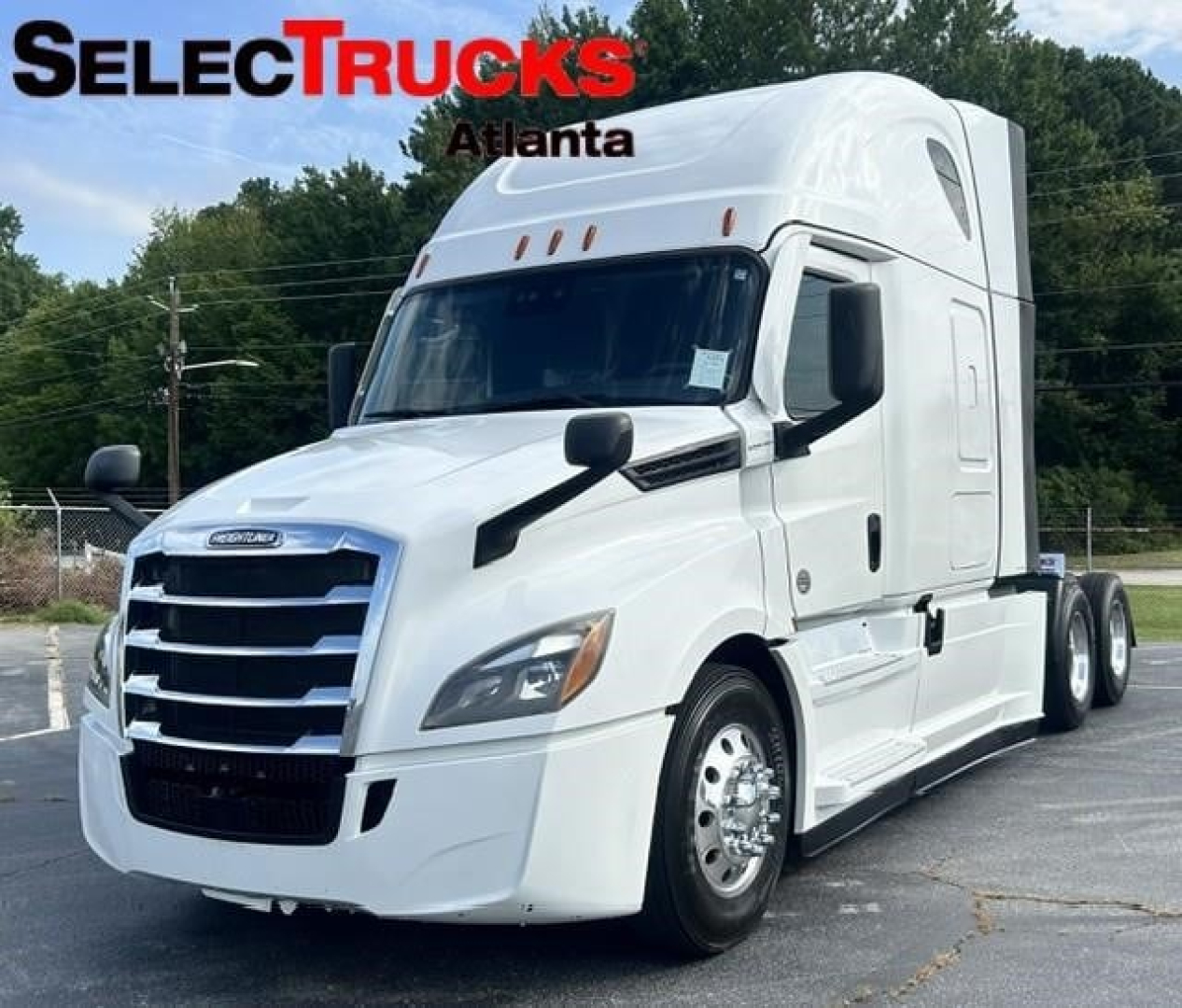 Truck image: 2021 Freightliner Cascadia 126 concrete white sleeper with chrome grille, front view showing SelectTrucks Atlanta logo.