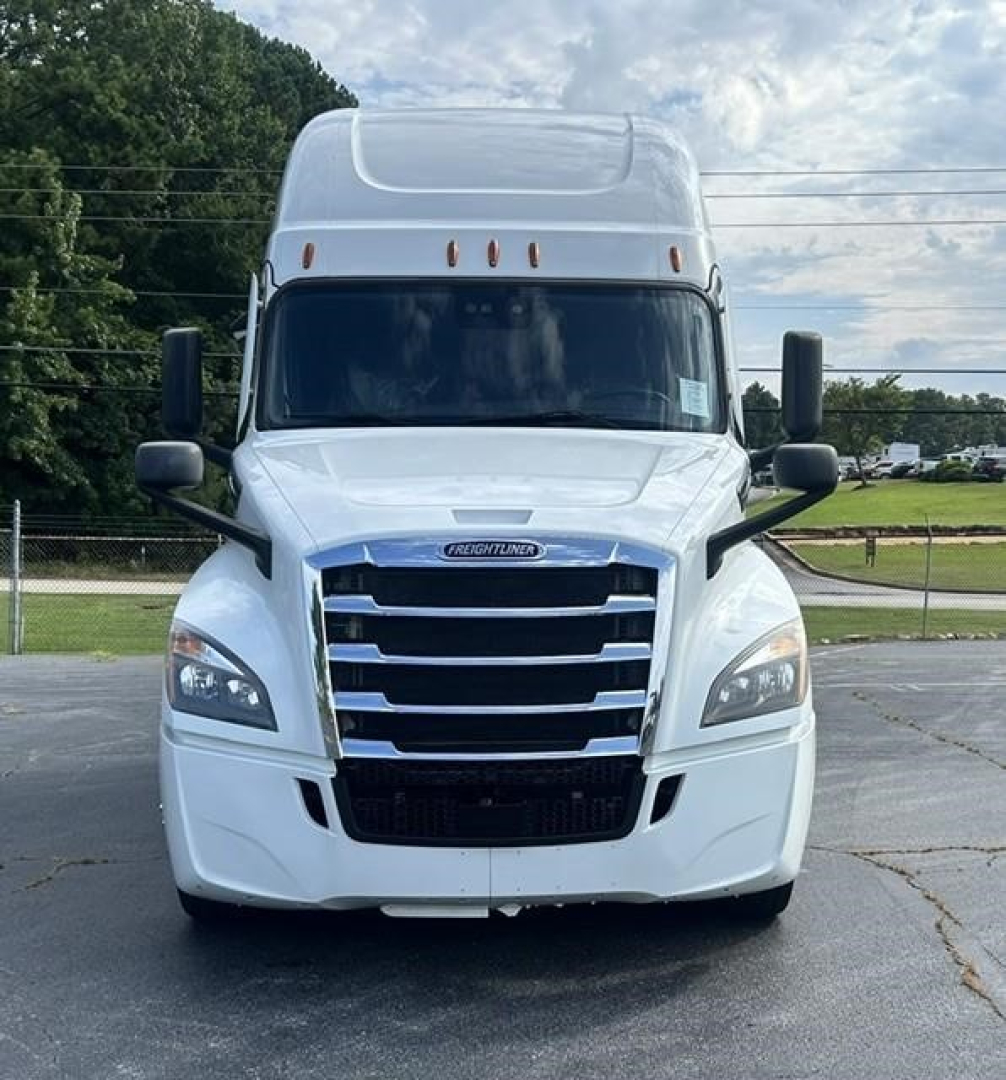 Freightliner Cascadia 126 truck front view showing radiator grille, headlights, and windshield with large mirrors.