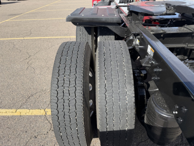 Kenworth T880 chassis with dual rear axles showing tires and frame view.