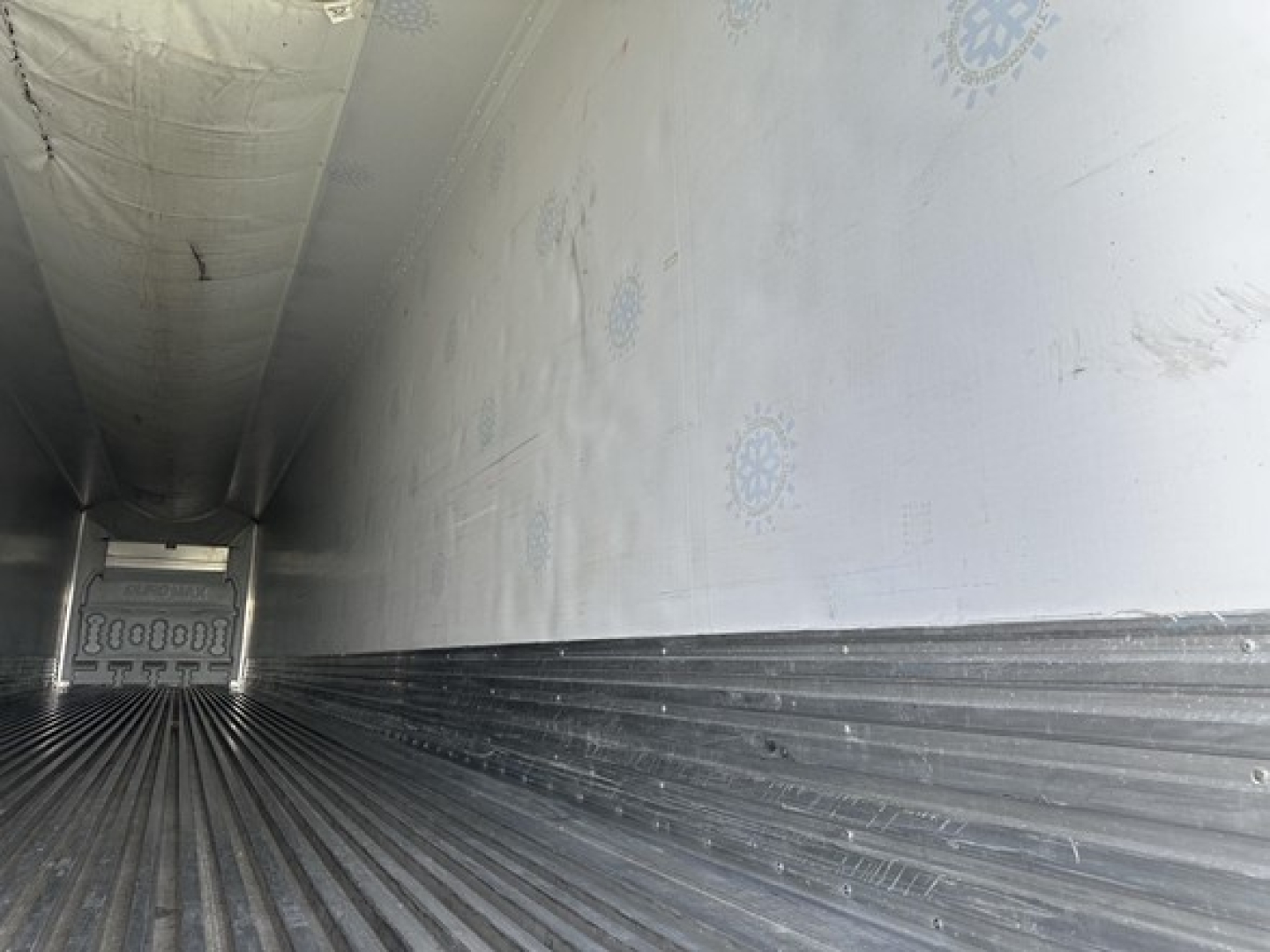 Interior of a Great Dane Carrier 7300 trailer cargo area with ribbed floor and smooth sidewalls.