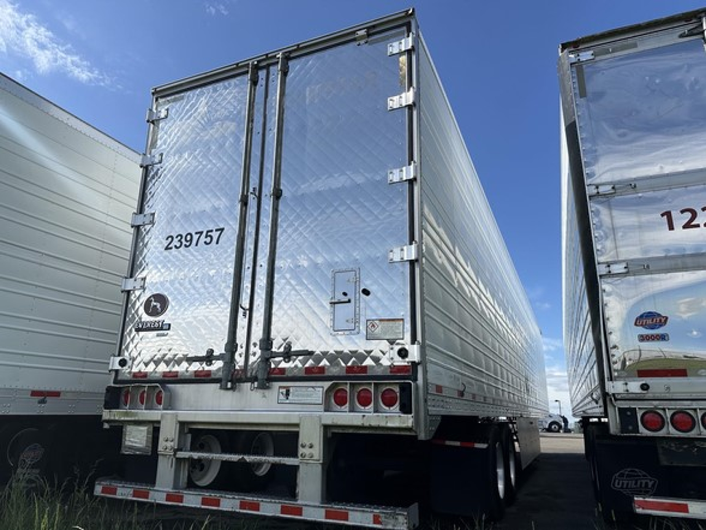 Great Dane Carrier trailer rear view showing metal silver exterior, back doors, and rear lights.