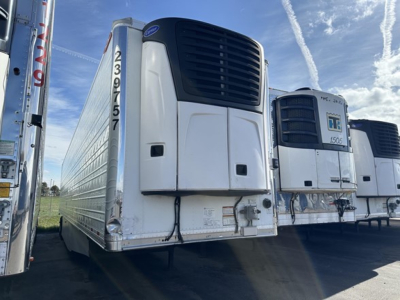 Great Dane 7300 refrigerated trailer in a row of trailers with front cooling unit and VIN visible on the nose.