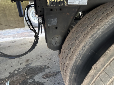 Great Dane air ride reefer trailer hitch area showing front dual tires and frame with wiring harness and label plate.