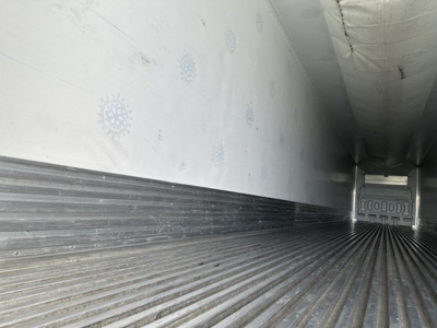 Trailer cargo area interior of a 2023 Great Dane Carrier 7300 reefer trailer showing corrugated metal floor and insulated walls.